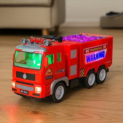 camion pompier jouet lumineux rouge dans le salon