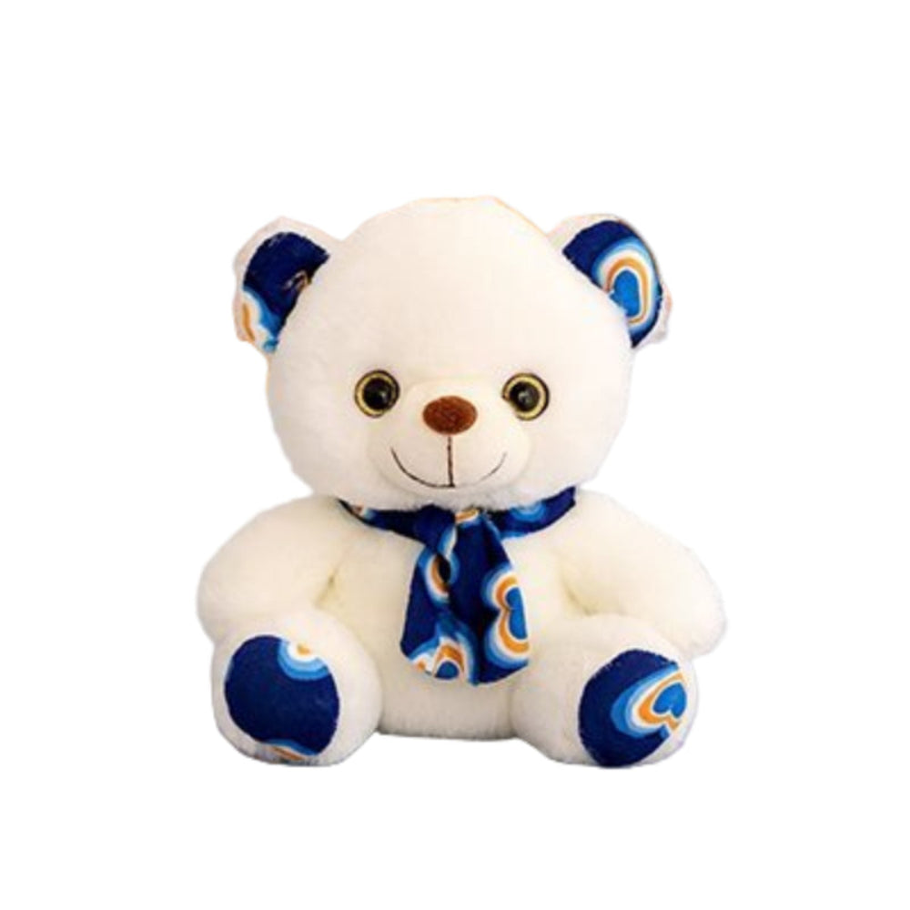 ours en peluche ultra doux bleu sur un lit