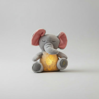 peluche interactive élephant lumineux sur le canapé