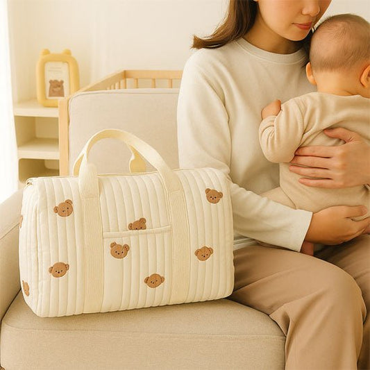 sac a langer bebe petit ours sur le canape